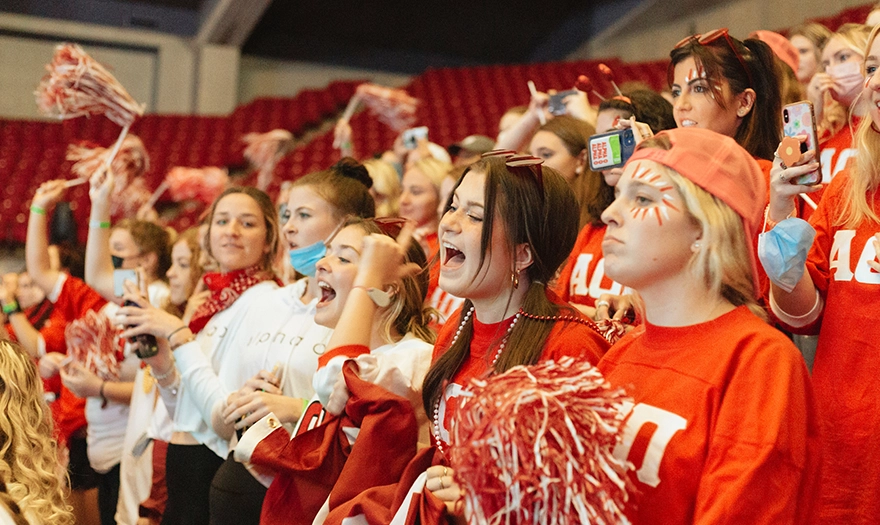 Students in the bleachers showing school spirit